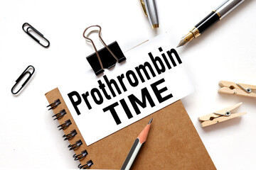 Prothrombin Time, text on white sticker on light table.