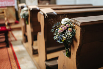 Flower decoration attached to a seat in a church