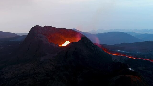 Night shot of the crater at Fagradalsfjall volcano volcanic explosive eruption on the Reykjanes Peninsula in Iceland.