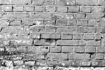 Texture of a brick wall with cracks and scratches which can be used as a background