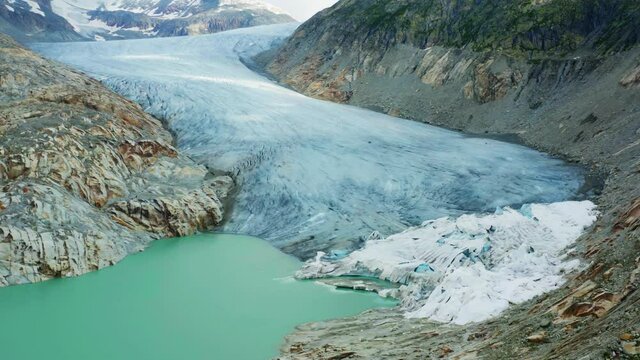 Switzerland, canton of Valais. Aerial view of the Rhone Glacier (Rhonegletscher) on a cloudy day 