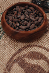 Coco seed preparing to make Chocolate. Cocoa beans in a wooden plate