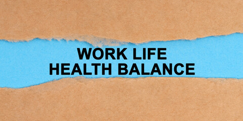 The paper is ripped in the middle. Inside on a blue background it is written - Work Life Health Balance