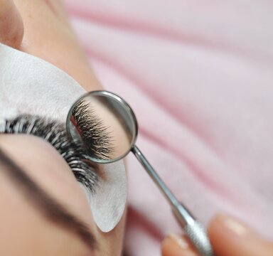 Lash extensions in beauty salon macro eye top view 