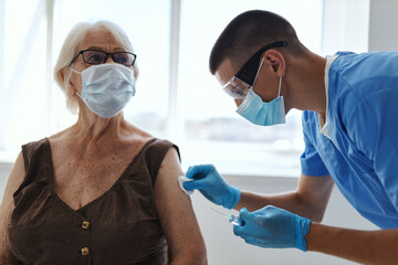 elderly woman and doctor hospital vaccine passport health