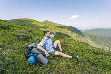 hiker in the mountains that looks like the beauty of the mountains. mountain hiking concept.