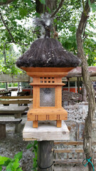 Bali garden lamp made of wood and straw