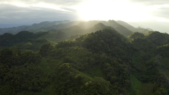 2021 - Excellent aerial shot of sunlight breaking over the Chiapas mountain range in Mexico.