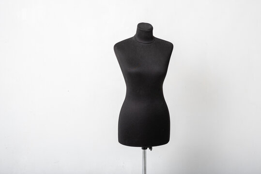 Black women sewing mannequin with basic labels to remove measures standing on a white background