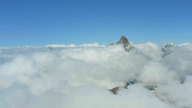 Aerial view of the Matterhorn - one of the best-known mountains in the Alps, straddling the frontier between Switzerland and Italy - towering above the clouds