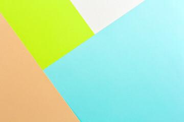bright pastel geometric composition of colored paper as background