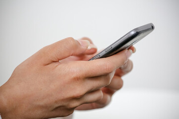 woman typing on a cell phone key in everyday social networks.
