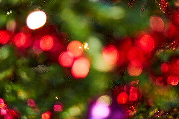 Colourful, sparkly & beautiful blurry circle bokeh, out of focus background.  Christmas tree with fairy lights concept and holiday theme