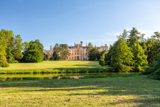 Lednice Chateau with beautiful gardens and parks on sunny summer day