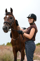 Obraz premium Portrait of a rider and her skewbald horse with a walk in nature