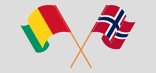 Crossed and waving flags of Guinea and Norway