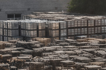 Storage of wooden pallets in an open warehouse. A bunch of industrial timber materials for transport and cargo transportation