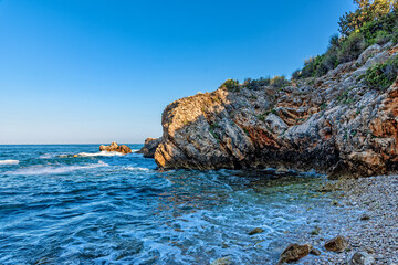 Tiny nudist beach between the rocks