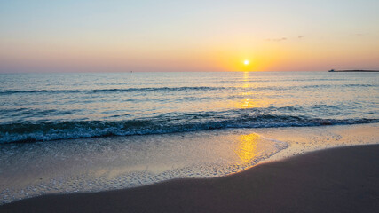 Fototapeta na wymiar Sunrise on the Mediterranean Sea. La Manga Del Mar Menor. Spain. 