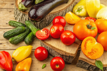 Assortment of fresh vegetables on a wooden background