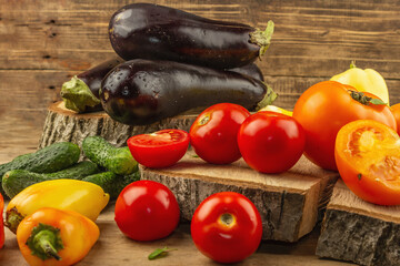 Assortment of fresh vegetables on a wooden background