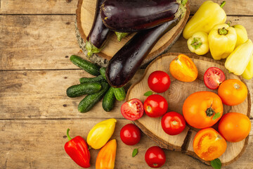 Assortment of fresh vegetables on a wooden background