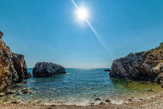 Tiny nudist beach between the rocks