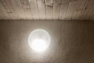 Lamp of dim light on the wall in the modern interior of the room style lighting