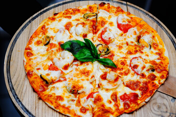 Seafood pizza on wooden board