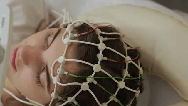 Patient brain testing using encephalography at medical center