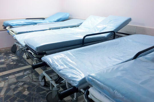 Corridor With Empty Medical Beds In A Hospital