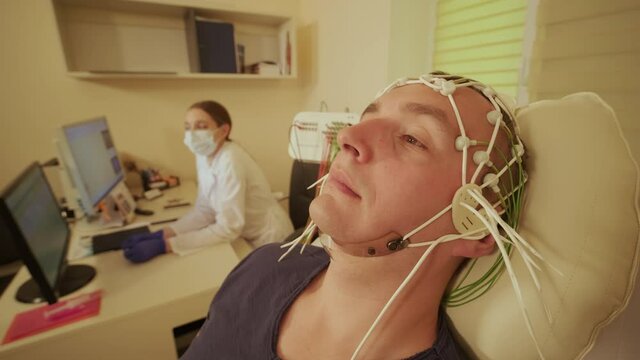 Patient brain testing using encephalography at medical center