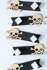 retro halloween wooden shape (skull and crossbones) on black wooden tags