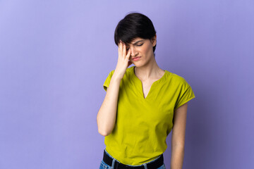 Woman with short hair isolated on purple background with headache