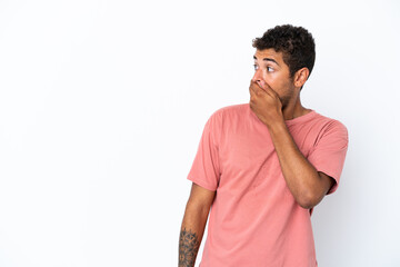 Fototapeta premium Young handsome Brazilian man isolated on white background doing surprise gesture while looking to the side