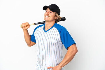 Young blonde man playing baseball isolated on white background posing with arms at hip and smiling