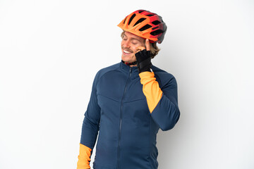 Young blonde cyclist man isolated on white background laughing