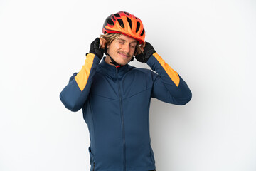 Young blonde cyclist man isolated on white background frustrated and covering ears