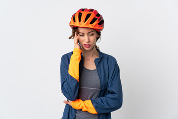 Young cyclist woman isolated on white background with headache