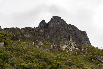 Fototapeta na wymiar Mountain called Pico de Pescado rises on the heights of a rocky hill.