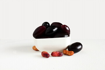 fresh jambolan plum, jamun,java plum,black jamun,syzygium cumini or jambhul fruit with seeds in white background