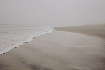 foggy rainy beach scene