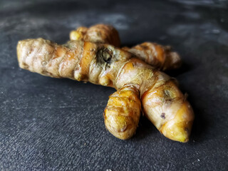 Close-up of turmeric texture on blurred background. Used for flavoring dishes and herbal drinks.