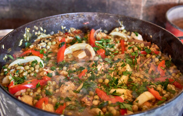 closeup spanish Seafood and chicken paella cooked on a disk. argentina. horizontal