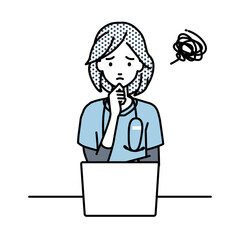 デスクで座ってPCを開いて困っている看護師の女性