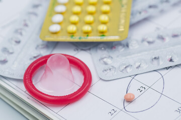Fototapeta premium condom and contraceptive on white background 