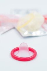 condom and contraceptive on white background
