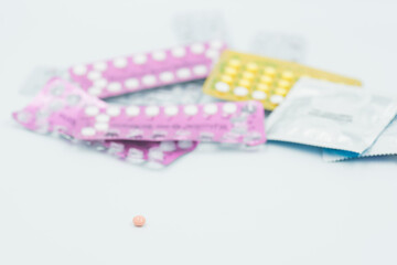 condom with contraceptive, birth control pill, safe sex
