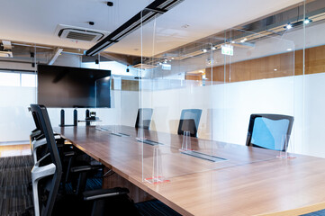 Television blank display in video conference meeting room with clear acrylic sheet separates the...