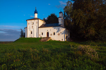 Fototapeta na wymiar Saint Nicholas Church in Gorodishche (Nikolskaya church) on Truvorov Gorodishche on a sunny cloudless summer evening. Stary Izborsk, Pskov region, Russia
